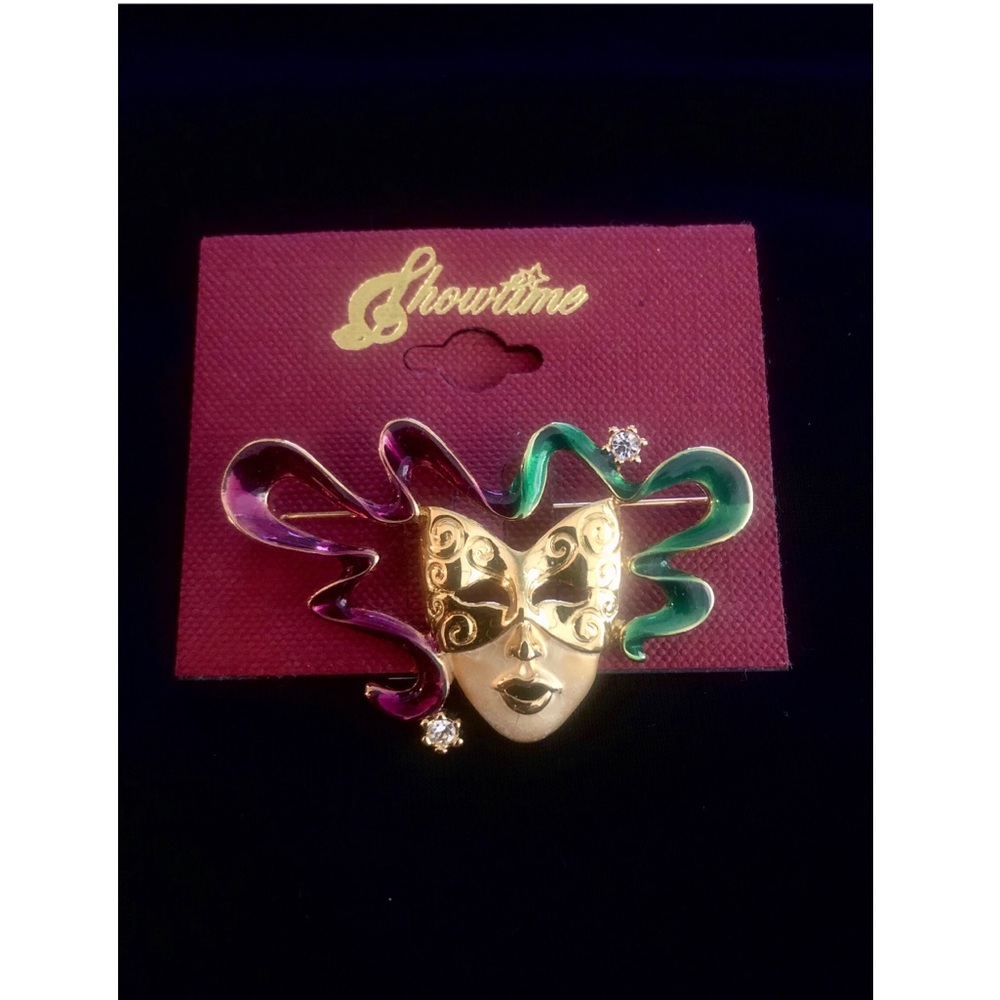 Masquerade Brooch. NWT. Colors Gold, purple, green